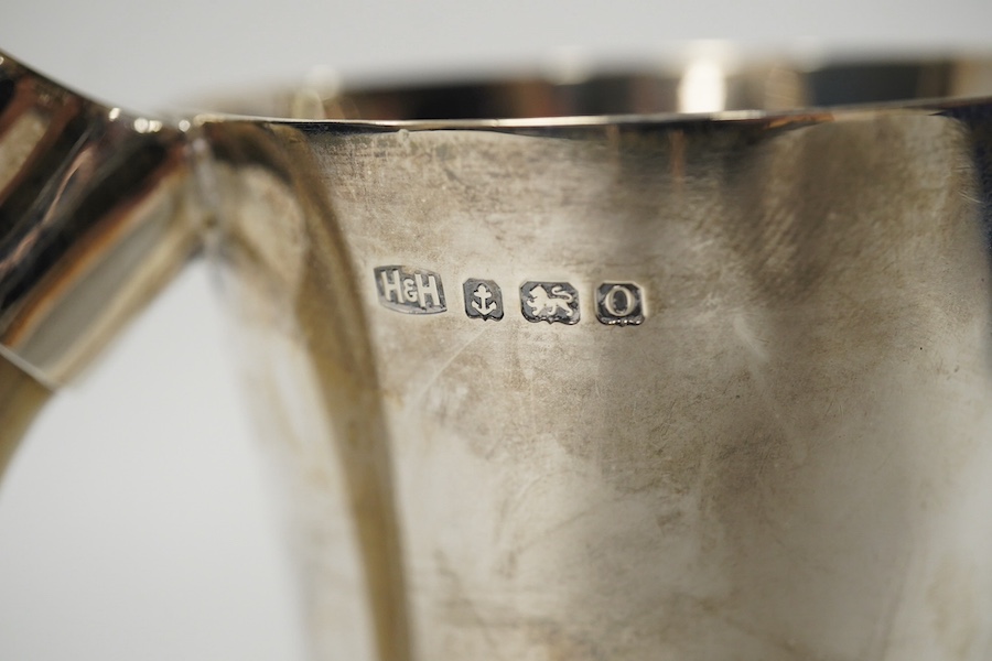 A George VI silver mug with a boar’s tusk handle, Hukin & Heath, Birmingham, 1938, height 11.8cm, gross weight 11.7oz. Condition - fair